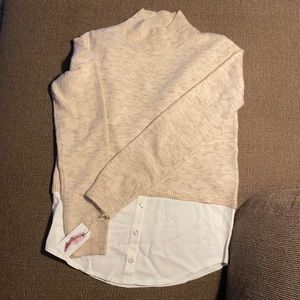 cream sweater with a hem shirt